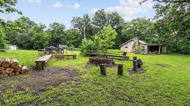 26725 S Bennett Rd, Freeman, MO 64746 - view of green lawn featuring an outbuilding