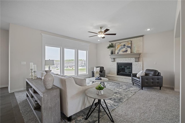 11487 S Cornice St, Olathe, KS 66061 - living room with baseboards, ceiling fan, a large fireplace, and recessed lighting