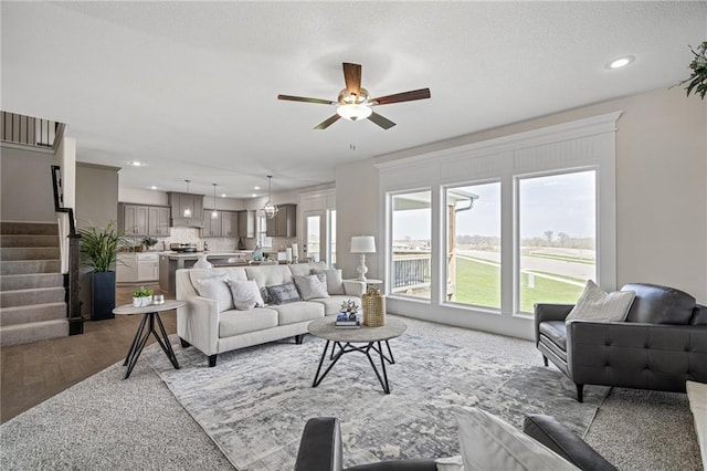 11487 S Cornice St, Olathe, KS 66061 - living area with ceiling fan, stairway, recessed lighting, and light wood-type flooring