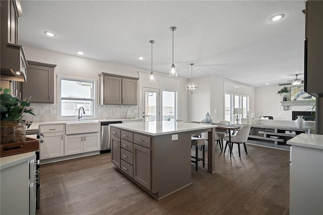 11487 S Cornice St, Olathe, KS 66061 - kitchen with a sink, backsplash, ceiling fan, plenty of natural light, and a textured ceiling