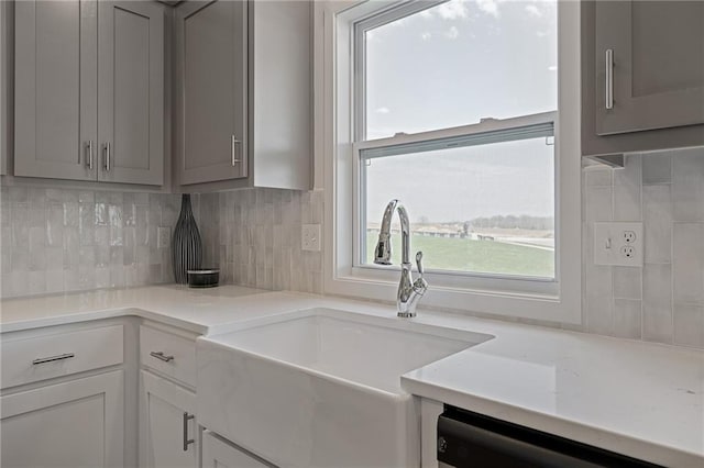11487 S Cornice St, Olathe, KS 66061 - kitchen featuring a sink, gray cabinetry, dishwasher, and tasteful backsplash