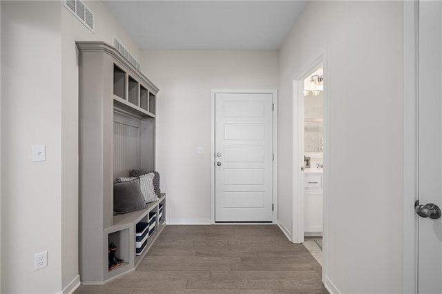 11487 S Cornice St, Olathe, KS 66061 - mudroom featuring wood finished floors and baseboards