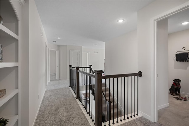 11487 S Cornice St, Olathe, KS 66061 - hall with an upstairs landing, baseboards, carpet flooring, recessed lighting, and built in shelves
