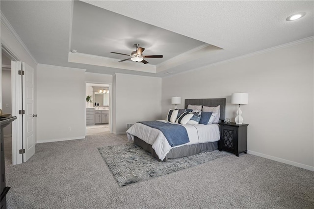 11487 S Cornice St, Olathe, KS 66061 - bedroom with crown molding, a tray ceiling, carpet flooring, baseboards, and ensuite bathroom