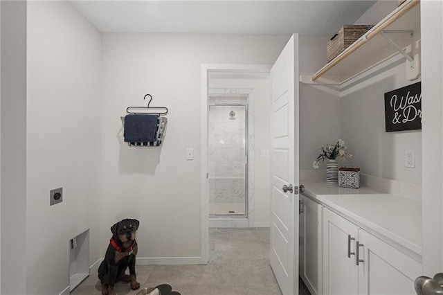 11487 S Cornice St, Olathe, KS 66061 - laundry room with electric dryer hookup, baseboards, and cabinet space