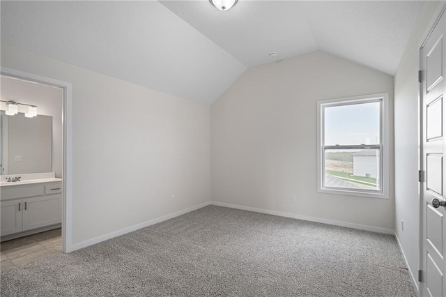 11487 S Cornice St, Olathe, KS 66061 - bonus room featuring light carpet, lofted ceiling, baseboards, and a sink
