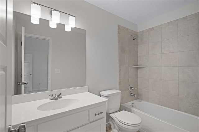 11487 S Cornice St, Olathe, KS 66061 - bathroom featuring vanity, toilet, and bathing tub / shower combination
