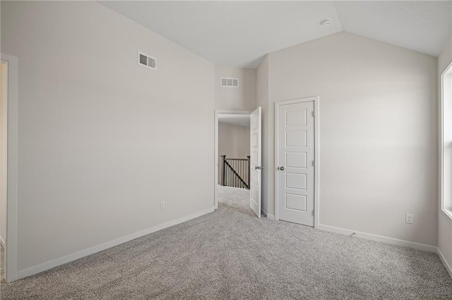 11487 S Cornice St, Olathe, KS 66061 - unfurnished bedroom featuring carpet, vaulted ceiling, and baseboards