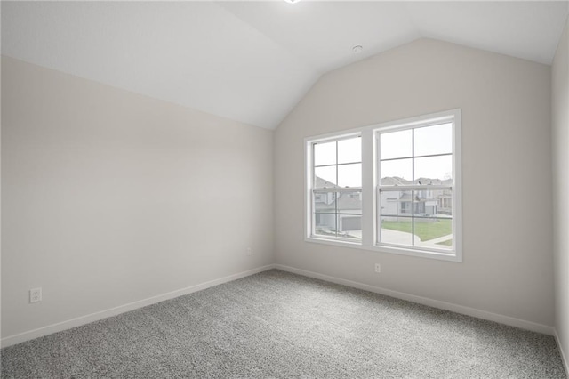 11487 S Cornice St, Olathe, KS 66061 - additional living space with plenty of natural light, vaulted ceiling, carpet, and baseboards