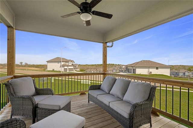 11487 S Cornice St, Olathe, KS 66061 - deck featuring ceiling fan, a residential view, an outdoor living space, and a lawn