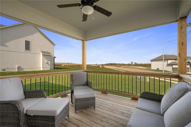 11487 S Cornice St, Olathe, KS 66061 - deck featuring a ceiling fan and a lawn