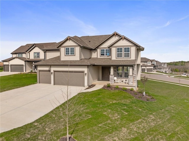 11487 S Cornice St, Olathe, KS 66061 - view of front of house with covered porch, driveway, a garage, a front yard, and a shingled roof