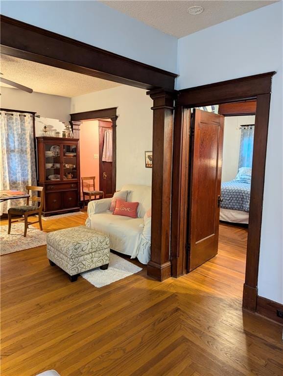 429 N 12th St, Fredonia, KS 66736 - living room with wood finished floors and a textured ceiling