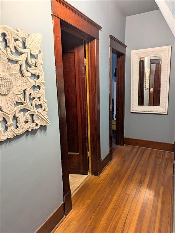 429 N 12th St, Fredonia, KS 66736 - corridor with baseboards and wood finished floors