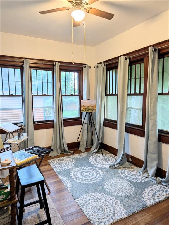 429 N 12th St, Fredonia, KS 66736 - living area with a ceiling fan, wood finished floors, and baseboards