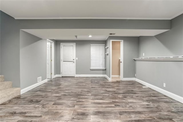 7132 Woodstock St, Shawnee, KS 66218 - below grade area featuring baseboards, wood finished floors, recessed lighting, and stairs