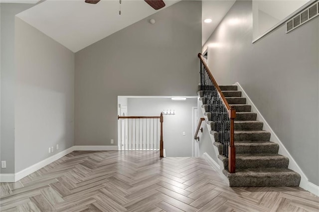 7132 Woodstock St, Shawnee, KS 66218 - stairway with a ceiling fan, baseboards, a towering ceiling, and recessed lighting
