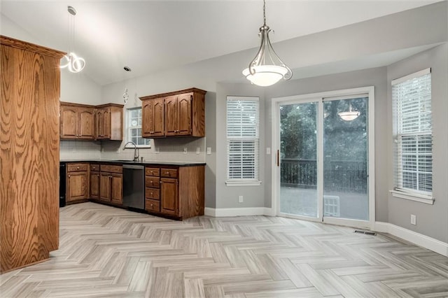 7132 Woodstock St, Shawnee, KS 66218 - kitchen featuring dishwasher, vaulted ceiling, baseboards, brown cabinets, and decorative light fixtures