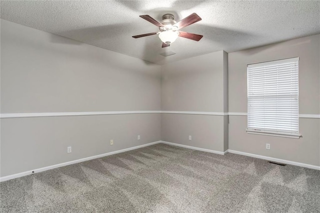 7132 Woodstock St, Shawnee, KS 66218 - empty room with ceiling fan, carpet floors, baseboards, and a textured ceiling
