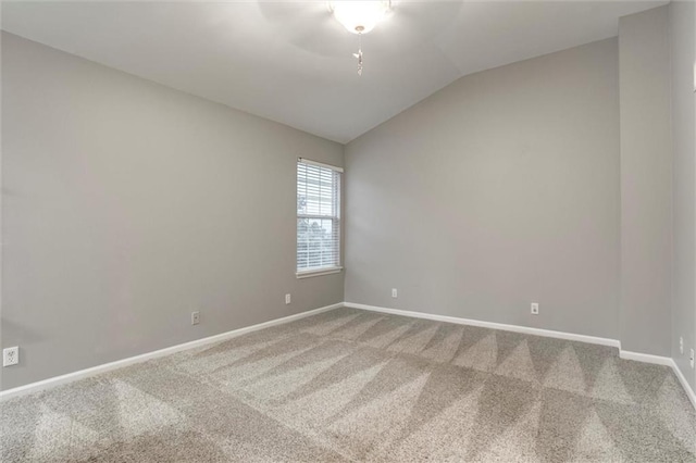 7132 Woodstock St, Shawnee, KS 66218 - carpeted empty room with vaulted ceiling and baseboards