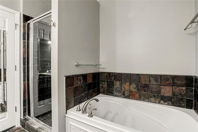 7132 Woodstock St, Shawnee, KS 66218 - bathroom with a garden tub and a shower stall