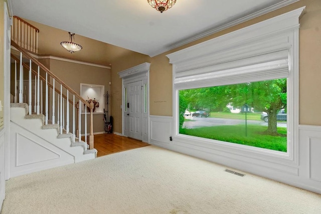 600 N Oak St, Gardner, KS 66030 - foyer entrance with wainscoting, stairs, and carpet