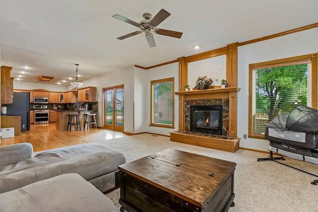 600 N Oak St, Gardner, KS 66030 - living area with healthy amount of natural light, ceiling fan, a large fireplace, ornamental molding, and recessed lighting