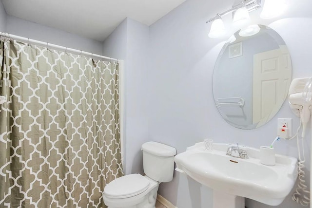 600 N Oak St, Gardner, KS 66030 - bathroom with a sink and a shower with shower curtain