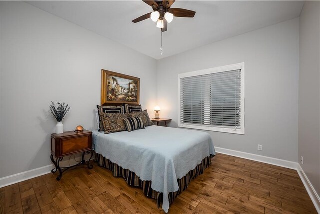 14165 Ashbury Ct, Basehor, KS 66007 - bedroom with baseboards, wood-type flooring, and ceiling fan