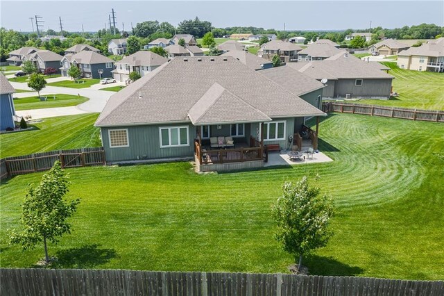 14165 Ashbury Ct, Basehor, KS 66007 - back of property with a residential view, roof with shingles, and a patio area