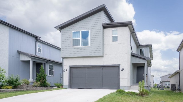 13333 W 180th St, Overland Park, KS 66013 - contemporary house featuring a garage, driveway, and central AC unit