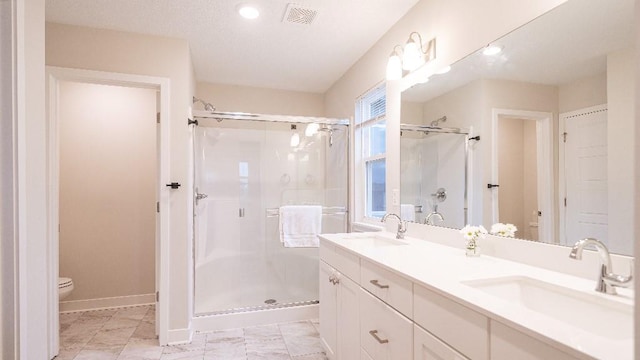 13333 W 180th St, Overland Park, KS 66013 - full bath with toilet, a shower stall, double vanity, baseboards, and recessed lighting