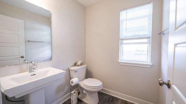 13333 W 180th St, Overland Park, KS 66013 - bathroom featuring toilet, a sink, baseboards, and wood finished floors