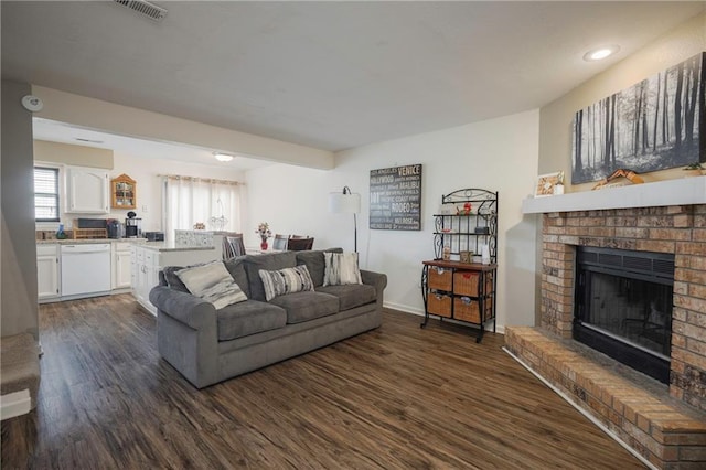 706 Cedar Dr Unit C, Warrensburg, MO 64093 - living area with dark wood finished floors and a fireplace