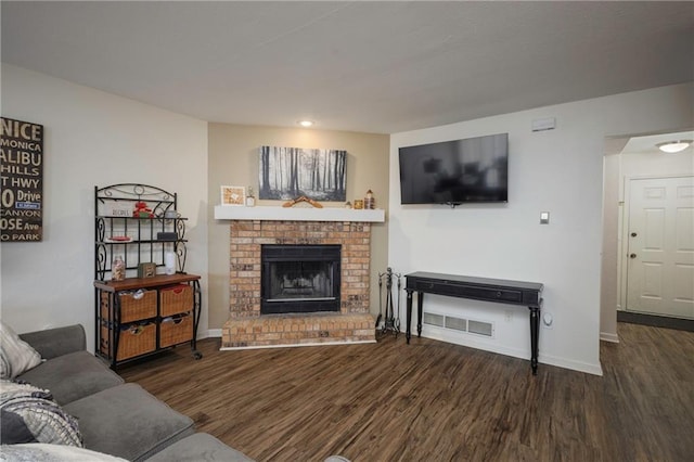 706 Cedar Dr Unit C, Warrensburg, MO 64093 - living room with wood finished floors, a brick fireplace, and recessed lighting
