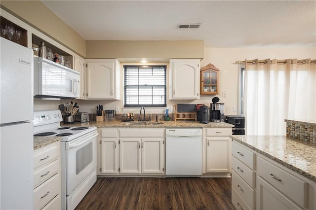 706 Cedar Dr Unit C, Warrensburg, MO 64093 - kitchen with white appliances, white cabinetry, dark wood finished floors, and light stone counters