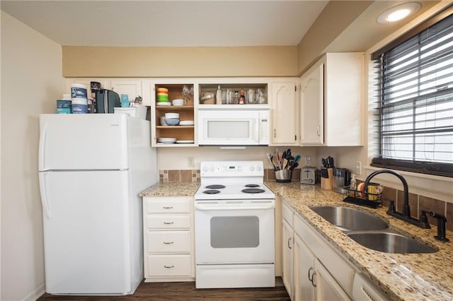 706 Cedar Dr Unit C, Warrensburg, MO 64093 - kitchen featuring white appliances, open shelves, light stone countertops, white cabinetry, and dark wood finished floors