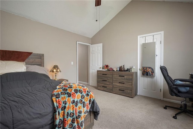 706 Cedar Dr Unit C, Warrensburg, MO 64093 - bedroom featuring light carpet, high vaulted ceiling, and a ceiling fan