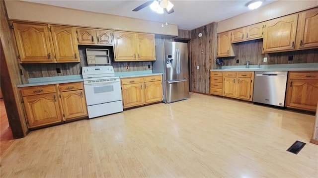 1045 Yale Rd, Mapleton, KS 66754 - kitchen with stainless steel appliances, light wood finished floors, light countertops, a sink, and ceiling fan