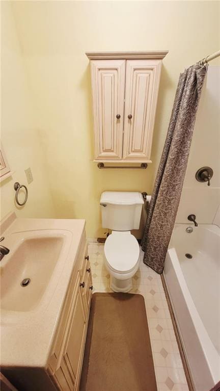 1045 Yale Rd, Mapleton, KS 66754 - full bathroom featuring toilet, vanity, shower / tub combo with curtain, and tile patterned floors