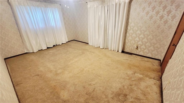 1045 Yale Rd, Mapleton, KS 66754 - carpeted empty room with wallpapered walls