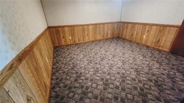 1045 Yale Rd, Mapleton, KS 66754 - detailed view of wallpapered walls, wooden walls, a wainscoted wall, and baseboards