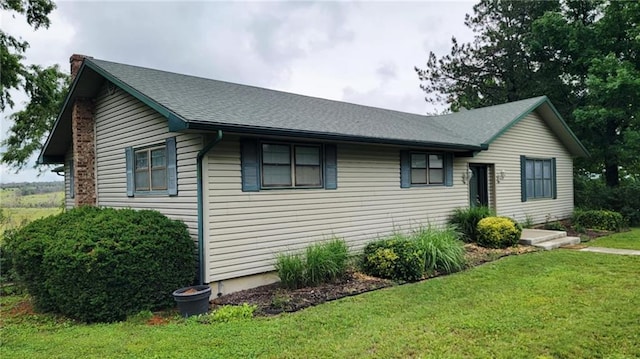 1045 Yale Rd, Mapleton, KS 66754 - single story home featuring a chimney, a front yard, and roof with shingles