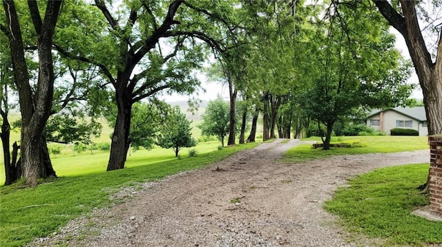 1045 Yale Rd, Mapleton, KS 66754 - view of community with dirt driveway and a lawn