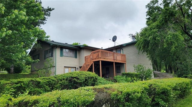 1045 Yale Rd, Mapleton, KS 66754 - rear view of house featuring a wooden deck and stairway