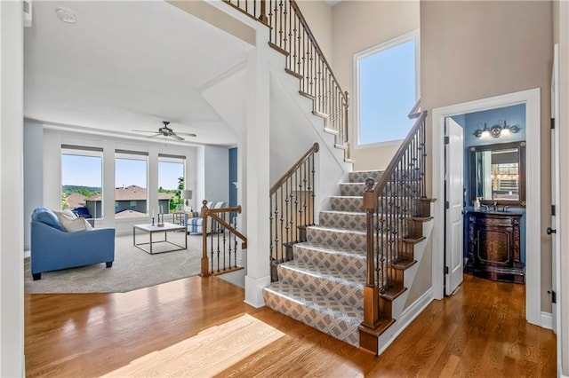 21222 W 46th Ter, Shawnee, KS 66218 - stairway featuring wood finished floors and a ceiling fan