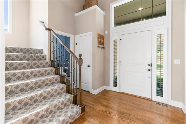 21222 W 46th Ter, Shawnee, KS 66218 - foyer entrance with stairs, light wood finished floors, and a towering ceiling