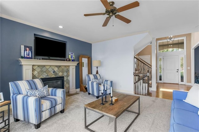 21222 W 46th Ter, Shawnee, KS 66218 - living room with stairway, a ceiling fan, ornamental molding, recessed lighting, and a tile fireplace
