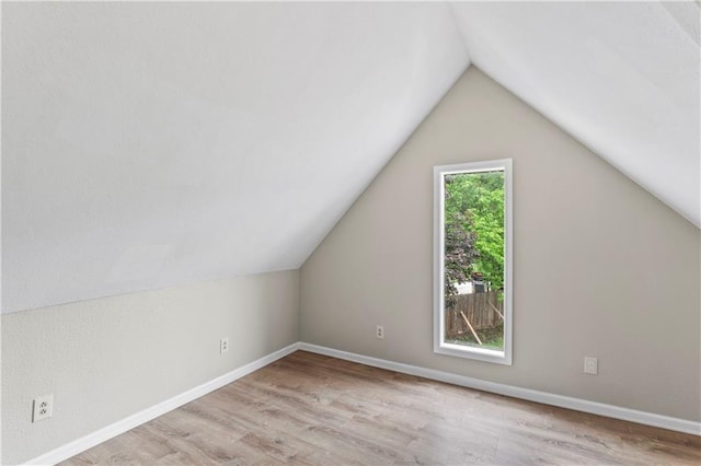803 E College St, Independence, MO 64050 - additional living space featuring wood finished floors, lofted ceiling, and baseboards