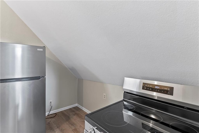 803 E College St, Independence, MO 64050 - kitchen view of stainless steel appliances, wood finished floors, and baseboards
